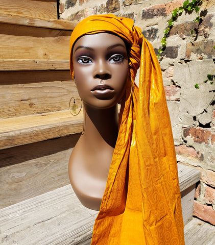Chichewa: Rust-Orange Wax African Head Wrap With Spiral Detail