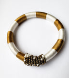 Issa VI: White/Black and Gold Bead andThread Bracelet